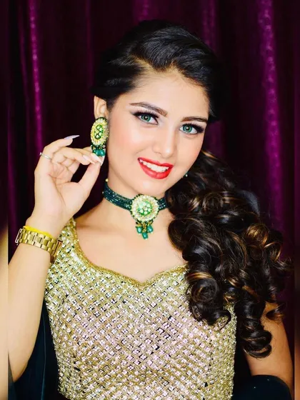 A close-up of a client wearing a beautiful green choker set with her rental outfit. I offer a variety of jewellery to perfectly match any dress you choose.