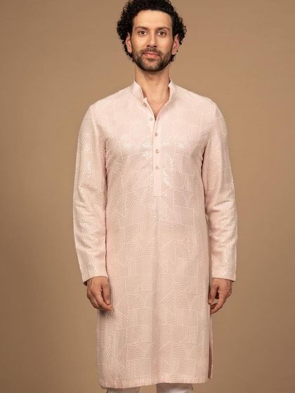 The full silhouette of the pink embroidered kurta. Its clean lines and sophisticated color make it a standout piece that is both elegant and contemporary.