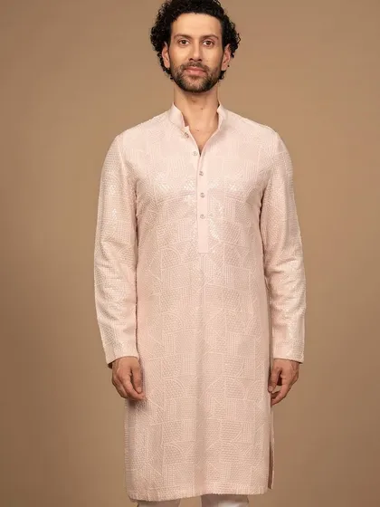 The full silhouette of the pink embroidered kurta. Its clean lines and sophisticated color make it a standout piece that is both elegant and contemporary.