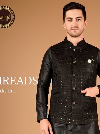 Threads of tradition. A black kurta paired with a black and silver patterned Nehru jacket, a sleek and modern ethnic look.
