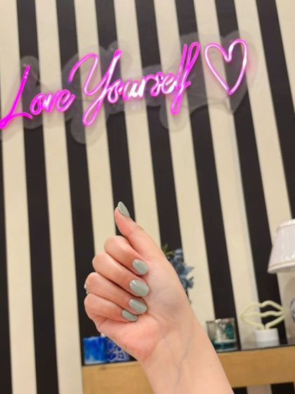 Sage green holochrome nails, a trendy and subtle way to wear the chrome effect.