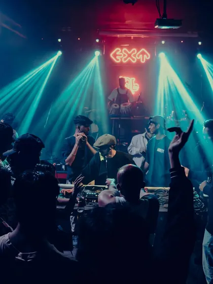 The energy in the club is a beautiful chaos. This shot captures the vibe of a packed house, with everyone lost in the music and the lights.