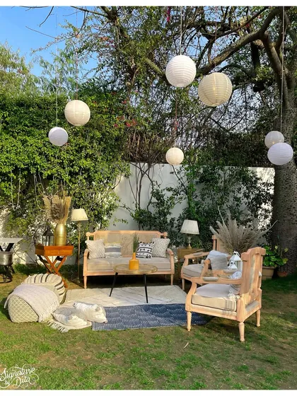 A duplicate of image 1, this bright, sunny shot showcases the inviting quality of the outdoor lounge setup, perfect for a daytime corporate retreat or social gathering.