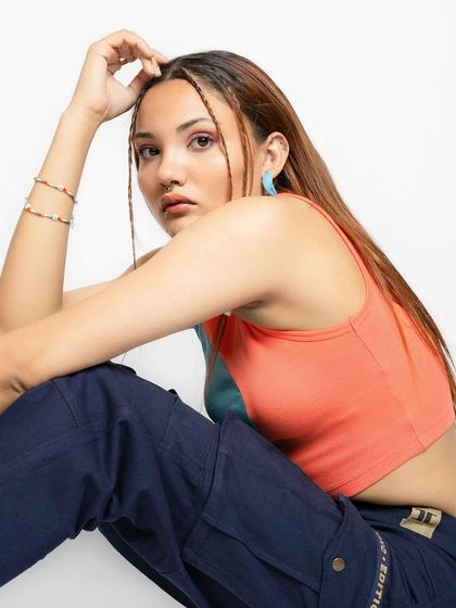 A close-up shot focusing on the accessories I used for the streetwear campaign. The colorful bracelets and thin braids add a personalized touch to the overall look.