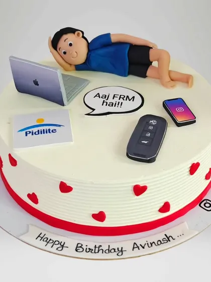 A humorous work-from-home themed cake for a husband's birthday. It features a relaxing figure with his laptop, phone, and car keys, with the message "Aaj FRM hai!!" (Today is FRM).