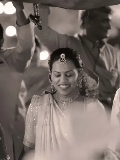 A timeless black and white shot of the bride's entrance. This classic style emphasizes the emotion and significance of the moment, creating a photograph that will never go out of style.