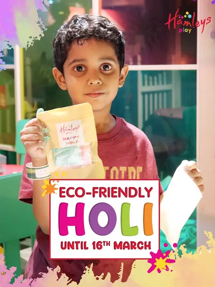 A proud young boy holds up the packet of eco-friendly Holi colors he made himself. It's wonderful to see them take ownership of their creations during our festive workshops.