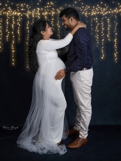 A magical moment under twinkling lights. This romantic setup is perfect for capturing the enchantment of pregnancy.