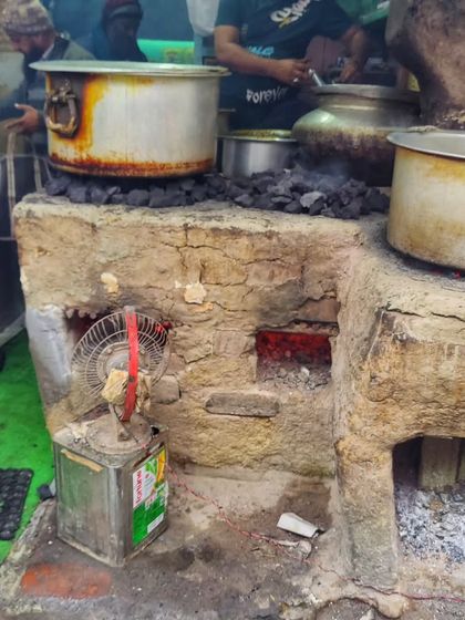 The heart of Lucknow's street food scene. These traditional coal stoves are where the magic happens, slow-cooking dishes for hours to develop incredible depth of flavour.