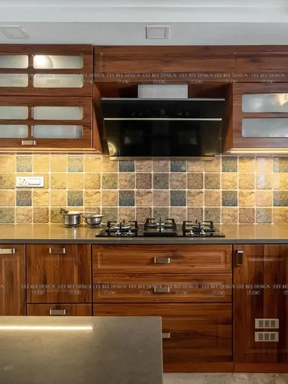 A close-up of the teakwood kitchen from image 20, focusing on the cooktop and tiled backsplash.