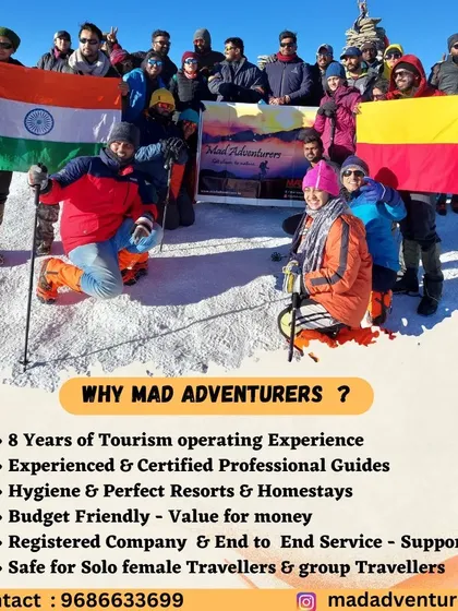 Our proud group at the Kedarkantha summit, holding the Indian and Karnataka flags high. We are a community of adventurers from Namma Bangalore, exploring the Himalayas together.