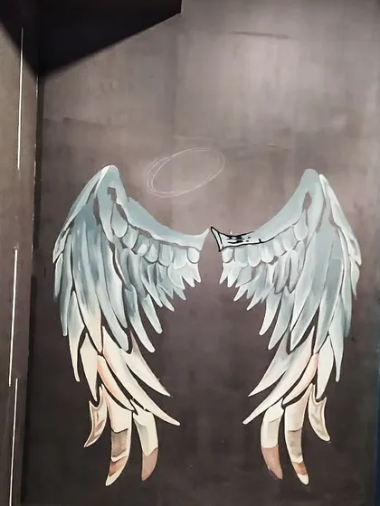 Here's a look at the angel wings mural before the final line work was added. The blending of colors is key to giving the wings depth.
