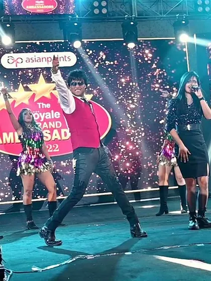 Another powerful shot from the Asian Paints 'Royale Grand Ambassador' event, with my co-singer and dancers creating a full stage picture.