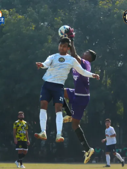 An aerial challenge between our attacker and the opposition goalkeeper. We fight for every ball, whether it's on the ground or in the air.