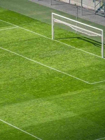 This high-angle view displays the scale and precision of our work. We ensure every line and boundary is perfectly marked, creating a professional football court that meets sporting standards.