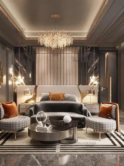We kept this dark-themed master bedroom opulent with a tasteful touch of gold accents. The design creates a sense of serenity and comfort, with a seating area at the foot of the bed for added luxury.