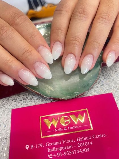 A classic and elegant baby boomer or ombré effect on almond-shaped extensions. The soft, milky-white gradient is timeless and perfect for any occasion.