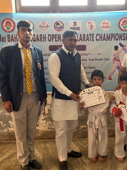 Two of my youngest students with their certificates. It's never too early to start the journey of discipline and achievement.