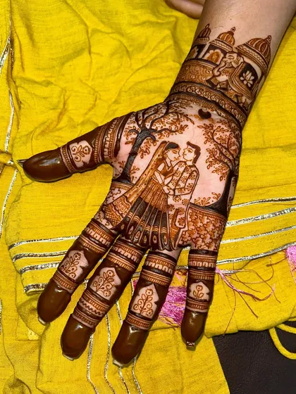 A still shot of a romantic couple portrait, perfect for Karwa Chauth or a bridal design. The surrounding tree and traditional finger patterns complete the look.