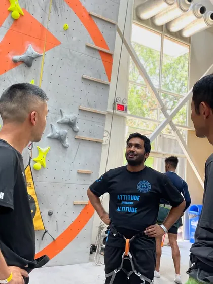 Friends hanging out between climbs. Our gym is not just a place to work out; it's a social hub where you can connect with like-minded people.
