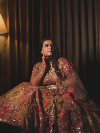 A dramatic and moody shot of the Sangeet lehenga. The intricate sequin and thread work caught the light beautifully, making her sparkle with every movement.
