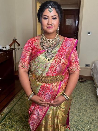 A traditional take on the mama-to-be glow. This look for a baby shower ceremony features a beautiful silk saree and classic makeup.