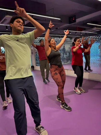 Another powerful pose from our dance session. These movements are not just fun, they also help in toning your arms and core.