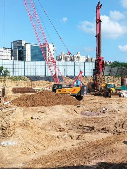 Breaking ground at the TCI Express World Centre. This image captures the very beginning of the construction phase, where heavy machinery prepares the site, marking the transition of our ideas into built form.