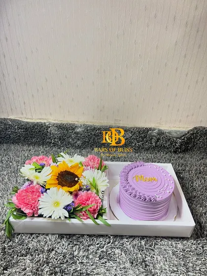 A clear, straight-on shot of the beautiful sunflower and cake tray for Mom.
