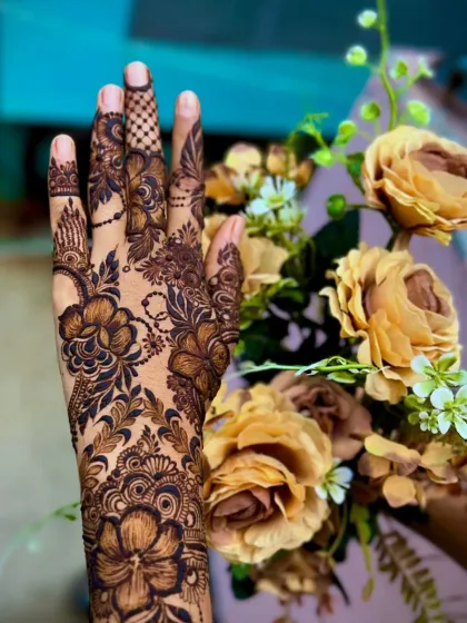 A close-up of a floral design, showing the beautiful details of the flowers and leaves against a matching floral background.