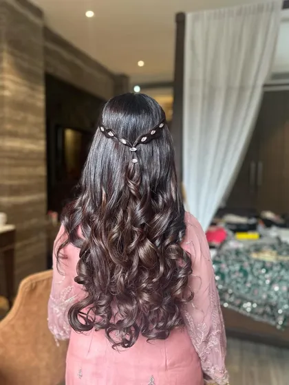 Another angle of the half-updo with big curls, showing the shine and volume I create with proper hair prep.