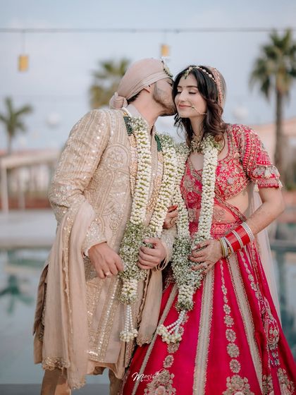 A tender kiss on the cheek, a sweet and intimate moment shared between the bride and groom after their wedding vows.