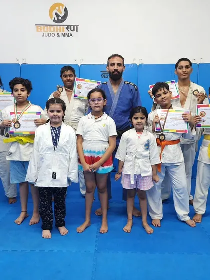 Our Judo team showcasing their hard earned medals from the Jigoro Kano Judo Tournament. We teach the principles of "The Gentle Way" to create formidable and respectful competitors.