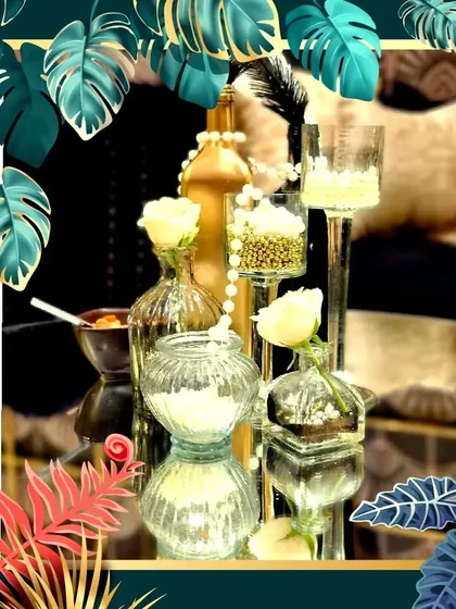 Even the smallest details are curated to fit the theme. This tablescape includes vintage-style glassware, pearl accents, and a single white rose, all reflecting the classic elegance of the black and gold event.