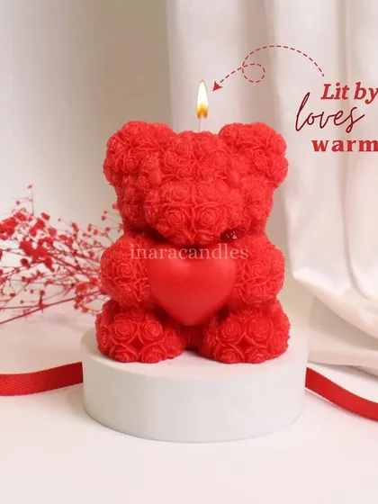 Lit by love's warmth. This adorable red teddy bear candle holding a heart is one of our most popular items for Valentine's Day gifting.