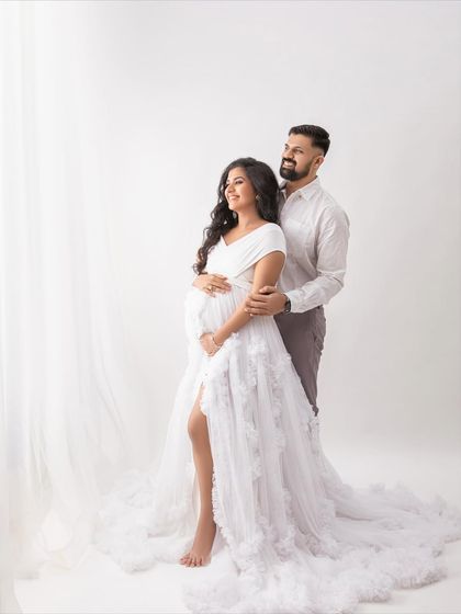 Looking towards the light, this pose symbolizes the bright future they are building together. A hopeful and beautiful portrait.