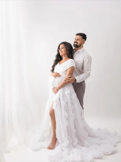 Looking towards the light, this pose symbolizes the bright future they are building together. A hopeful and beautiful portrait.