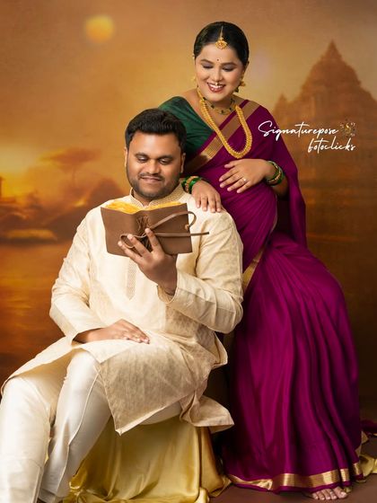 The partner reads from a book in this classic, posed shot that tells a story of shared values and anticipation.