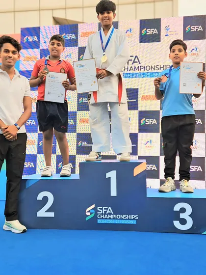 Posing with my medalists. Each one of them fought with heart and skill.