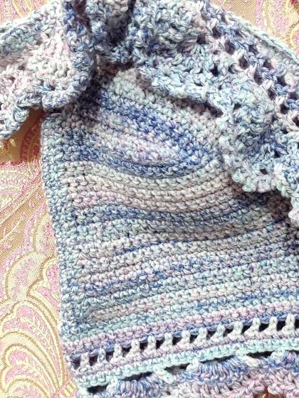 A custom-made 'Masakali' bralette top in a beautiful blue-purple variegated yarn. It features delicate lace details, off-the-shoulder ruffles, and adjustable straps for a perfect, comfortable fit.