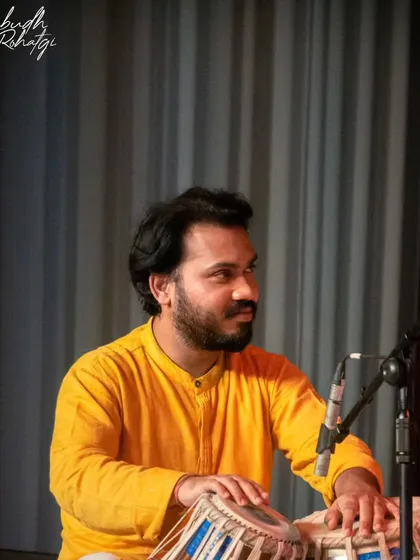 A gallery of cherished moments accompanying the legendary vocalist, Guruji Padma Bhushan Pandit Ajoy Chakraborty ji, at various prestigious festivals.
