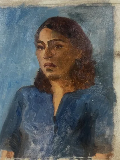 The finished portrait of Mirra, seen from a slight angle on the easel. This 9x12 inch oil on linen piece was a joy to create.