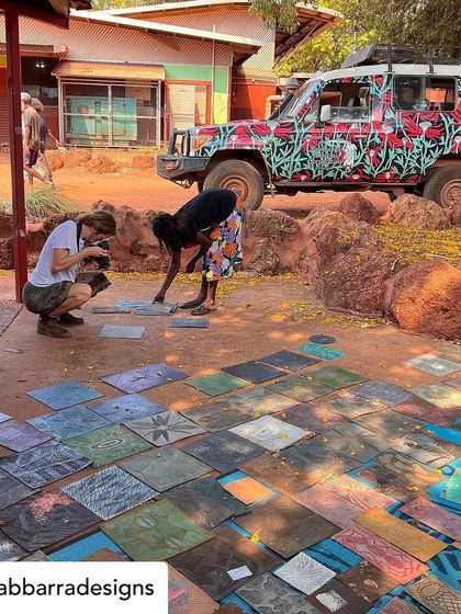 Our collaboration with the artisans of Bábbarra Designs is a story that continues to unfold. Here, they are selecting historic lino tiles which our artisans will translate into durable teak woodblocks, preserving their craft for a new generation.
