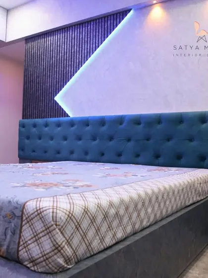 The tufted headboard is set against a textured wall with dramatic lighting, creating a luxurious and moody ambiance.