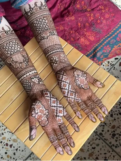A unique bridal design with shaded floral blocks and check patterns. This modern take on bridal henna is perfect for the contemporary bride.