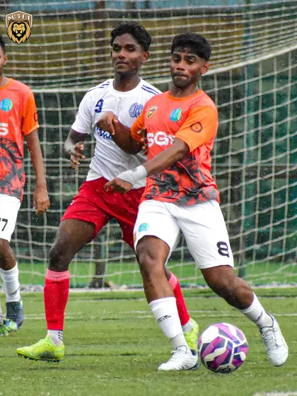 Holding off a challenger. Our players are trained to be physically dominant and protect the ball at all costs.