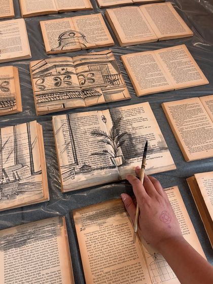 My hand painting over the pages of vintage books. For this project, I sketched scenes of an Old Goa villa directly onto the text, blending literary and visual storytelling.