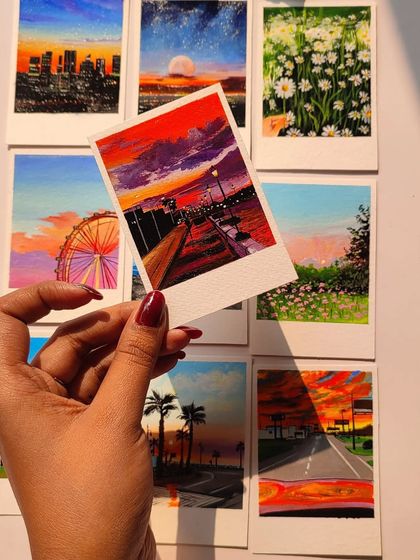 I also offer custom-painted polaroids. This is a collection of various landscape and sunset scenes I've painted in a polaroid format. They make for beautiful, tiny pieces of art to decorate your space.