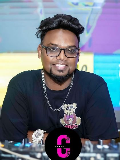 A smile from behind the console. I genuinely enjoy what I do, and that passion translates into the music I play for corporate gatherings and private parties.