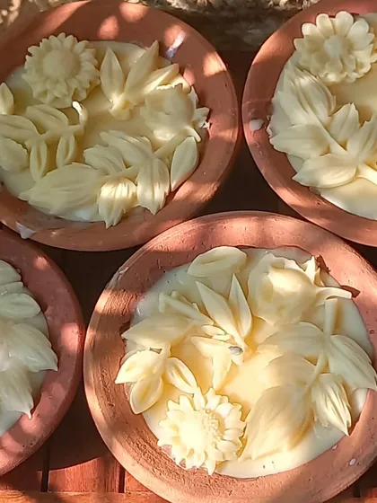 Our Mitti Diya candles, ready for Diwali. The intricate floral designs are hand-poured with organic beeswax into traditional terracotta diyas, making them a beautiful and sustainable choice for your celebrations.